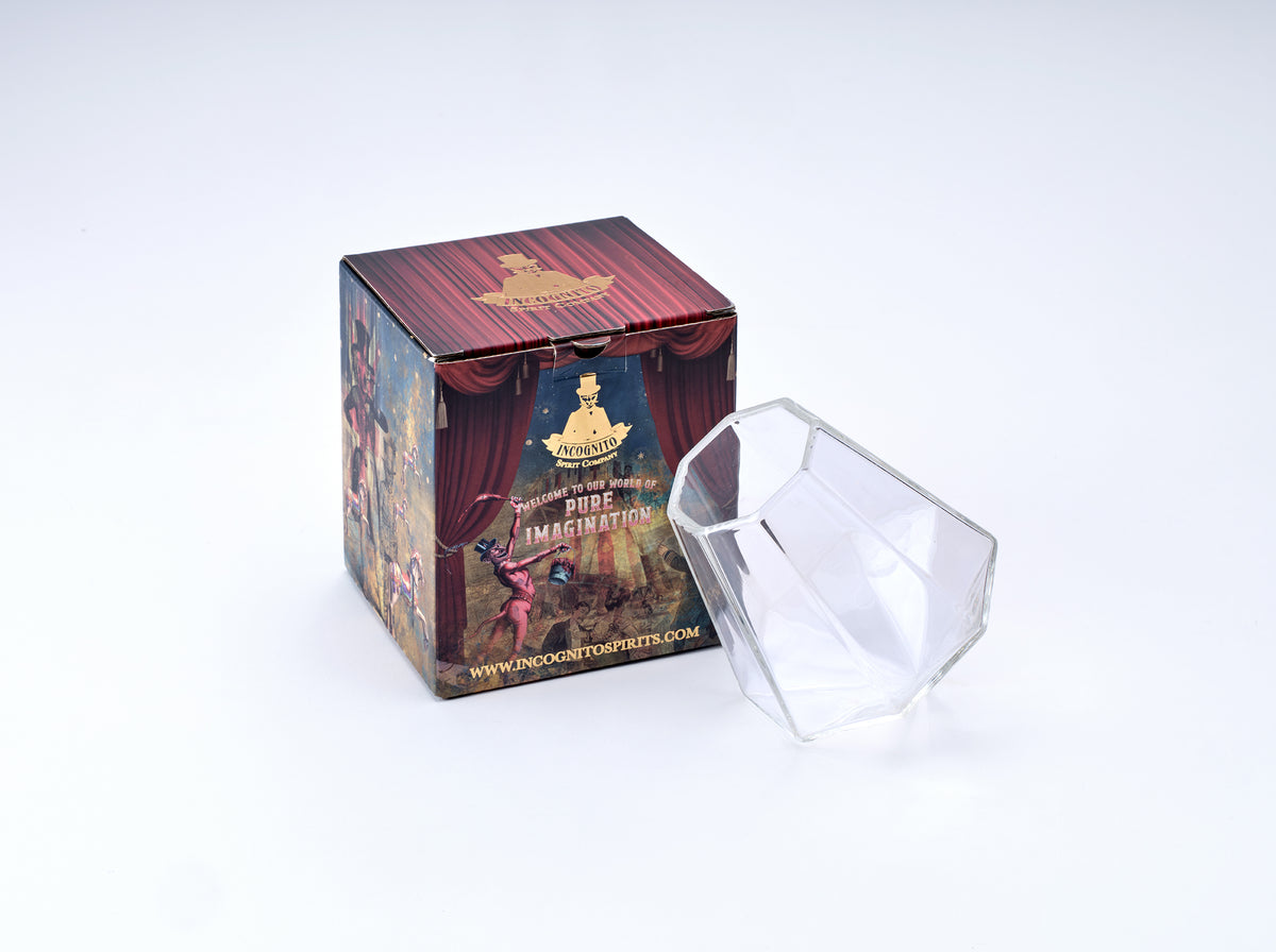 Incognito Diamond Glass, a clear faceted cocktail and spirits glass with a diamond shaped design, presented in an Incognito Spirits gift box.