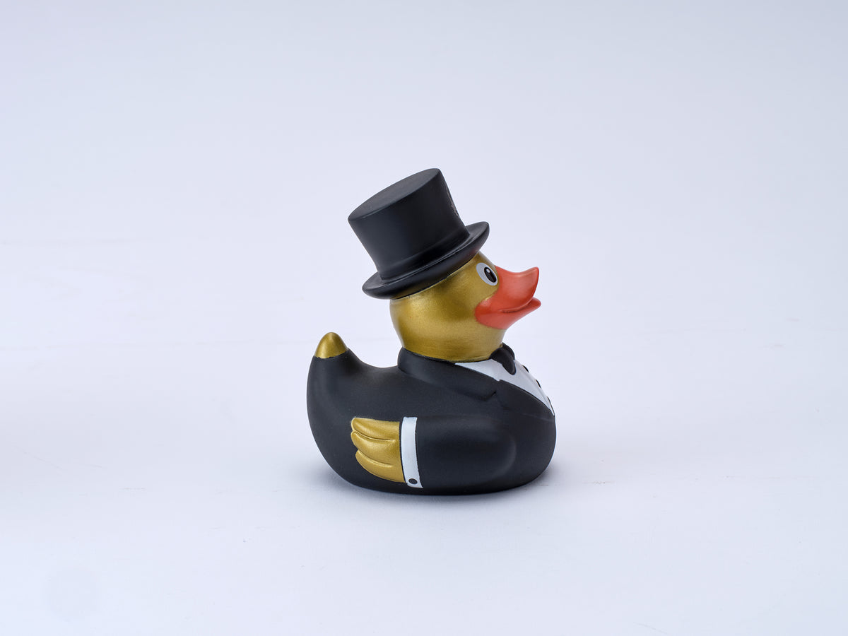 Incognito bartender Rubber Duck wearing a black dinner suit, bow tie and top hat with gold detailing, presented in a theatrical Incognito gift box.