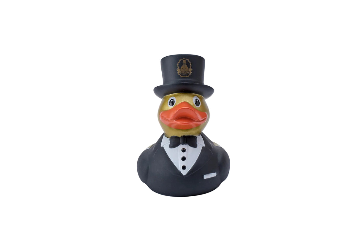 Incognito bartender Rubber Duck wearing a black dinner suit, bow tie and top hat with gold detailing, presented in a theatrical Incognito gift box.