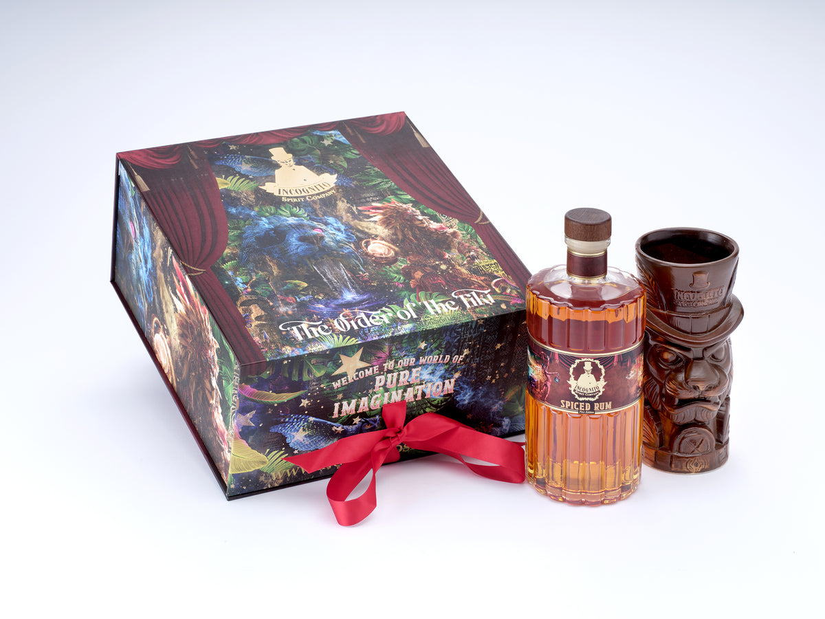 Incognito Order of the Tiki luxury gift set with Incognito Spiced Rum and collectible Tiki Mug, presented in a premium illustrated gift box and gift bag.