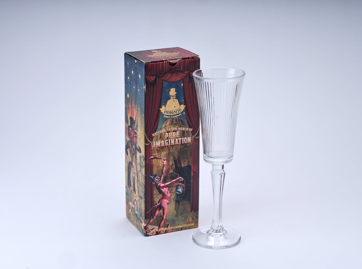 Incognito Champagne Flute with elegant ribbed glass in a speakeasy style, tall decorative stem and theatrical Incognito Spirits gift box.