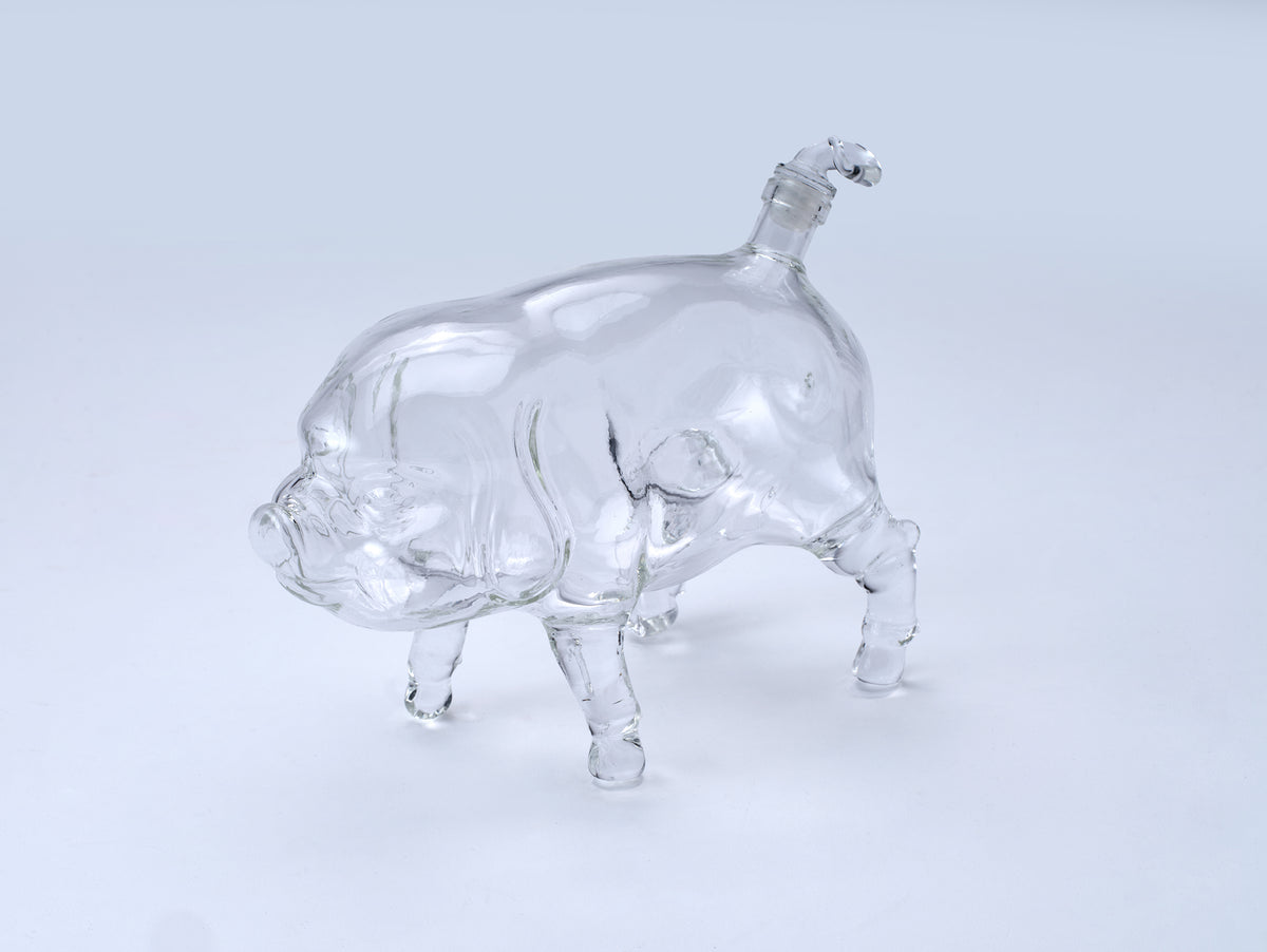 A clear glass pig decanter. Perfect for storing liquids. 